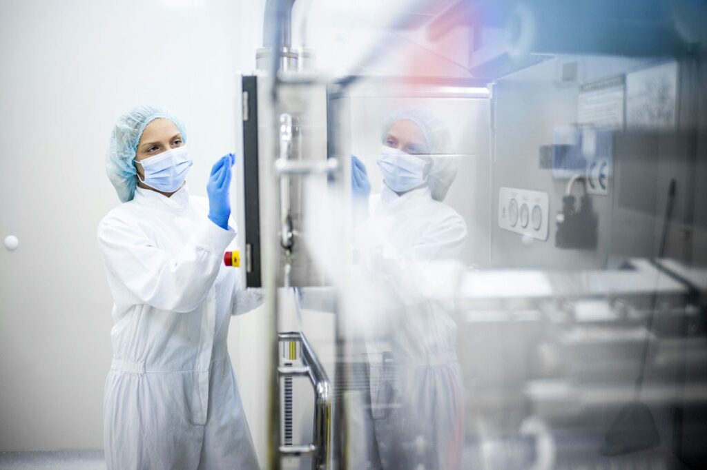 woman working in a pharmaceutical cleanroom