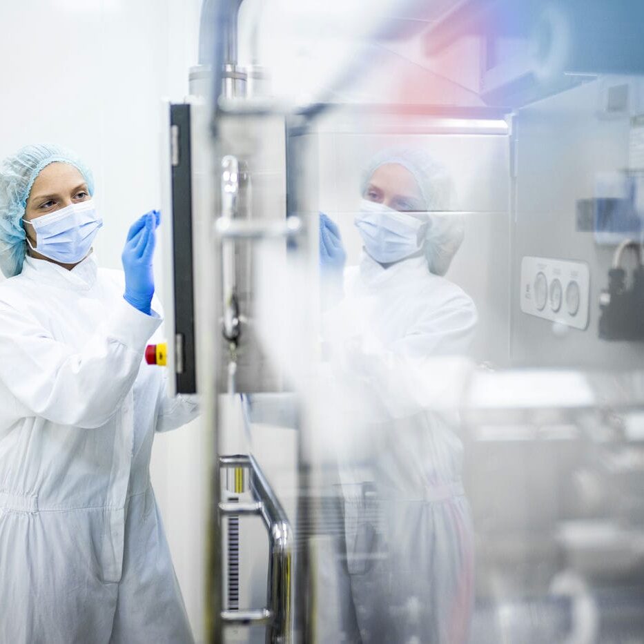 woman working in a pharmaceutical cleanroom